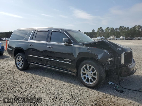 2015 GMC Yukon XL Denali with VIN 1GKS2JKJ5FR243343, listed as a Copart auction lot 51352125 with 142,996 mi miles and Salvage Title. Bid and sale history available at DreamBid. Image 4.