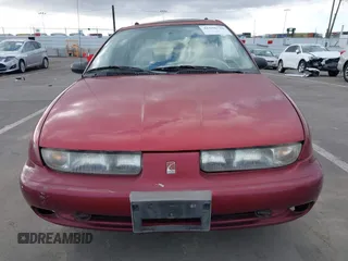1999 Saturn SW z VIN 1G8ZK8276XZ333989, wystawiony jako IAAI lot #41550338 z przebiegiem 142 592 mil mil oraz . Historia ofert i sprzedaży dostępna na DreamBid. Obrazek 12.