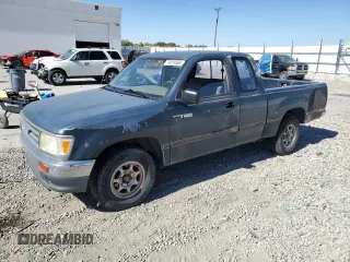 1995 Toyota T100 DX with VIN JT4VD12E0S0005758, listed as a Copart auction lot 74018364 with 394,656 mi miles and Salvage Title. Bid and sale history available at carsss.com. Image 1.
