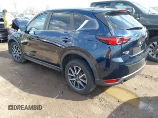 2018 Mazda CX-5 Touring with VIN JM3KFBCM5J0369799, listed as a IAAI auction lot 41895364 with 76,801 mi miles and . Bid and sale history available at carsss.com. Image 3.