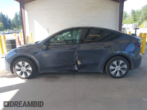 2023 Tesla Model Y Long Range with VIN 7SAYGAEE4PF906577, listed as a IAAI auction lot 42174987 with 13,260 mi miles and . Bid and sale history available at DreamBid. Image 14.