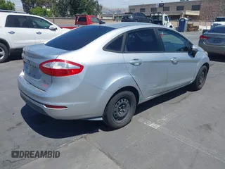 2014 Ford Fiesta S z VIN 3FADP4AJ0EM102338, wystawiony jako IAAI lot #42670979 z przebiegiem 141 301 mil mil oraz . Historia ofert i sprzedaży dostępna na DreamBid. Obrazek 4.