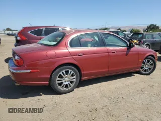 2003 Jaguar S-Type z VIN SAJEA01U13HM90556, wystawiony jako Copart lot #59578535 z przebiegiem 50 723 mil mil oraz Czysty tytuł • Clean title. Historia ofert i sprzedaży dostępna na DreamBid. Obrazek 3.