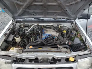 2000 Nissan Frontier XE z VIN 1N6ED27Y8YC368144, wystawiony jako Copart lot #87784565 z przebiegiem Nie podano mil oraz Czysty tytuł • Clean title. Historia ofert i sprzedaży dostępna na DreamBid. Obrazek 11.