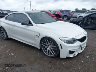 2015 BMW M4 with VIN WBS3R9C59FK330059, listed as a IAAI auction lot 40015188 with 85,510 mi miles. Bid and sale history available at carsss.com. Image 1.