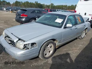 2002 Ford Crown Victoria LX z VIN 2FAFP74W42X100691, wystawiony jako IAAI lot #41316550 z przebiegiem 193 517 mil mil oraz . Historia ofert i sprzedaży dostępna na DreamBid. Obrazek 16.