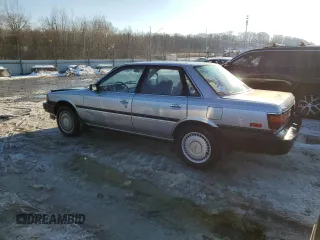 1990 Toyota Camry z VIN 4T1VV21EXLU008760, wystawiony jako Copart lot #88344665 z przebiegiem 154 971 mil mil oraz Nie do naprawy • Non repairable. Historia ofert i sprzedaży dostępna na DreamBid. Obrazek 2.
