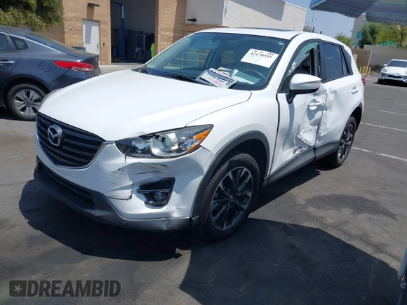 2016 Mazda CX-5 Grand Touring z VIN JM3KE2DY2G0824802, wystawiony jako IAAI lot #42170591 z przebiegiem 53 173 mil mil oraz . Historia ofert i sprzedaży dostępna na DreamBid. Obrazek 18.