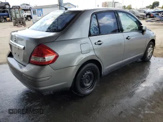 2011 Nissan Versa S with VIN 3N1BC1AP3BL404551, listed as a Copart auction lot 51977085 with 207,070 mi miles and Salvage title. Bid and sale history available at DreamBid. Image 3.