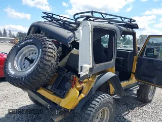 2003 Jeep Wrangler Rubicon with VIN 1J4FA69S93P302102, listed as a IAAI auction lot 42312951 with 146,408 mi miles and . Bid and sale history available at DreamBid. Image 6.
