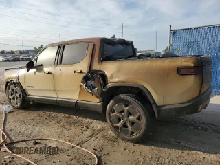 2023 Rivian R1T Adventure z VIN 7FCTGBAA6PN028517, wystawiony jako Copart lot #73712354 z przebiegiem Nie podano mil oraz Nie do naprawy. Historia ofert i sprzedaży dostępna na DreamBid. Obrazek 2.