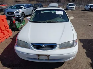 1998 Mazda 626 DX with VIN 1YVGF22CXW5702980, listed as a IAAI auction lot 41778063 with 104,672 mi miles. Bid and sale history available at carsss.com. Image 6.