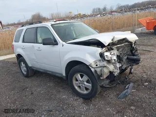 2010 Ford Escape XLT with VIN 1FMCU0DG5AKB75953, listed as a IAAI auction lot 40954756 with 154,588 mi miles. Bid and sale history available at carsss.com. Image 1.