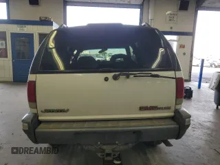 1996 GMC Jimmy SL with VIN 1GKDT13W4T2572197, listed as a Copart auction lot 76535534 with 157,624 mi miles and Salvage Title. Bid and sale history available at carsss.com. Image 6.
