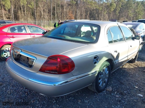 2002 Lincoln Continental with VIN 1LNHM97V12Y699605, listed as a IAAI auction lot 41235748 with 1 mi miles. Bid and sale history available at carsss.com. Image 4.