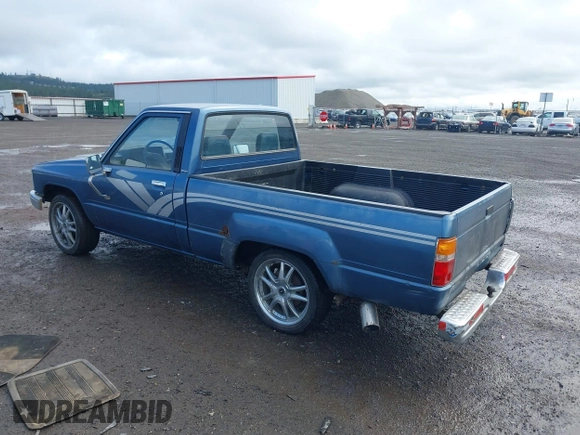 1988 Toyota Pickup with VIN JT4RN50R5J5169942, listed as a IAAI auction lot 42152517 with 218,579 mi miles and . Bid and sale history available at DreamBid. Image 3.
