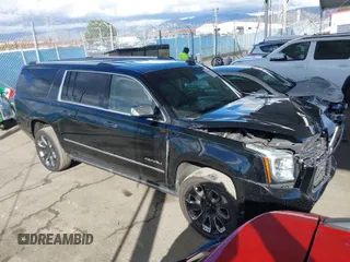 2019 GMC Yukon XL Denali with VIN 1GKS2HKJ3KR126587, listed as a IAAI auction lot 41796180 with 61,221 mi miles. Bid and sale history available at carsss.com. Image 1.