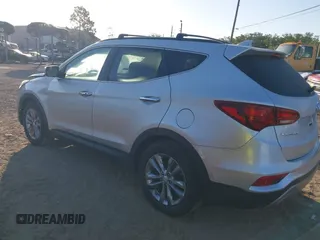 2018 Hyundai Santa Fe 2.0T z VIN 5XYZU4LA1JG516466, wystawiony jako IAAI lot #42265607 z przebiegiem 110 655 mil mil oraz . Historia ofert i sprzedaży dostępna na DreamBid. Obrazek 3.