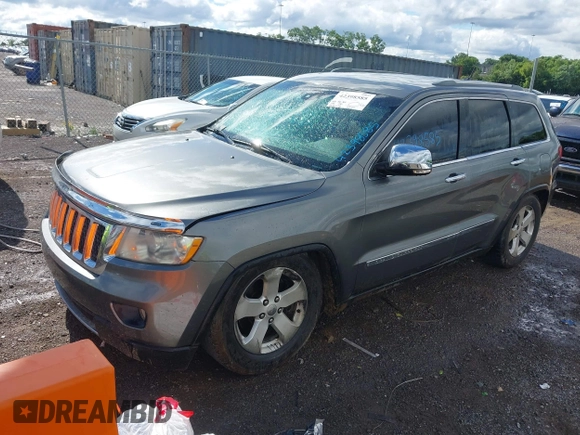 2011 Jeep Grand Cherokee Overland Summit with VIN 1J4RR6GT3BC713812, listed as a IAAI auction lot 42398585 with 208,476 mi miles and . Bid and sale history available at DreamBid. Image 2.