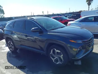 2022 Hyundai Tucson SEL with VIN 5NMJCCAEXNH061242, listed as a IAAI auction lot 41866145 with 63,501 mi miles and . Bid and sale history available at carsss.com. Image 12.