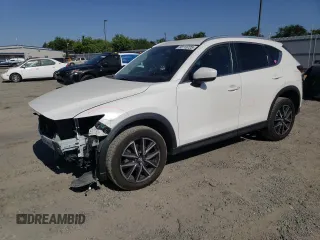 2018 Mazda CX-5 Touring z VIN JM3KFACM7J0370737, wystawiony jako Copart lot #60113725 z przebiegiem 131 385 mil mil oraz Szkoda całkowita • Salvage title. Historia ofert i sprzedaży dostępna na DreamBid. Obrazek 1.