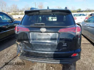 2018 Toyota RAV4 LE with VIN 2T3BFREV8JW706999, listed as a IAAI auction lot 41863485 with 115,589 mi miles. Bid and sale history available at carsss.com. Image 16.