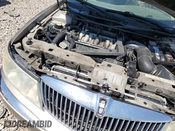 2001 Lincoln Continental z VIN 1LNHM97V21Y698784, wystawiony jako Copart lot #64040134 z przebiegiem Nie podano mil oraz Szkoda całkowita • Salvage title. Historia ofert i sprzedaży dostępna na DreamBid. Obrazek 11.