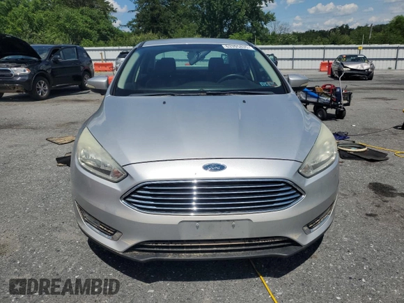 2015 Ford Focus Titanium with VIN 1FADP3J27FL267339, listed as a Copart auction lot 63395835 with 73,372 mi miles and Salvage title. Bid and sale history available at DreamBid. Image 5.