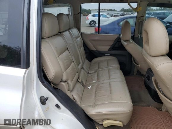 2002 Mitsubishi Montero Limited z VIN JA4MW51R52J027289, wystawiony jako Copart lot #71921024 z przebiegiem 199 334 mil mil oraz Czysty tytuł • Clean title. Historia ofert i sprzedaży dostępna na DreamBid. Obrazek 11.