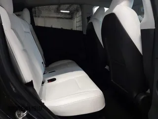 2024 Tesla Model Y Performance with VIN 7SAYGDEFXRF049338, listed as a IAAI auction lot 41240812 with 10,132 mi miles and . Bid and sale history available at DreamBid. Image 8.