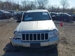 2008 Jeep Grand Cherokee Laredo with VIN 1J8GR48K28C169859, listed as a IAAI auction lot 41965149 with 166,069 mi miles. Bid and sale history available at carsss.com. Image 12.