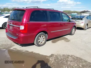 2012 Chrysler Town & Country Touring-L with VIN 2C4RC1CG6CR144174, listed as a IAAI auction lot 42003682 with 172,453 mi miles. Bid and sale history available at carsss.com. Image 4.