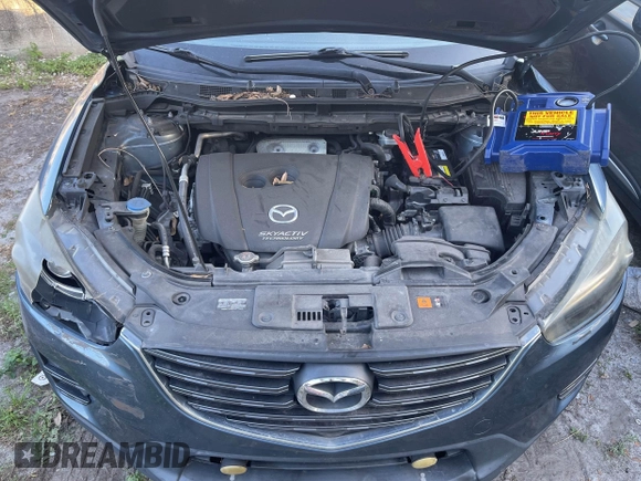 2016 Mazda CX-5 Grand Touring with VIN JM3KE4DY9G0673789, listed as a IAAI auction lot 42196841 with 98,622 mi miles and . Bid and sale history available at DreamBid. Image 10.