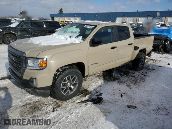 2021 GMC Canyon 4WD AT4 z VIN 1GTG6FEN8M1157828, wystawiony jako Copart lot #88392435 z przebiegiem 45 252 mil mil oraz Szkody całkowita. Historia ofert i sprzedaży dostępna na DreamBid. Obrazek 1.