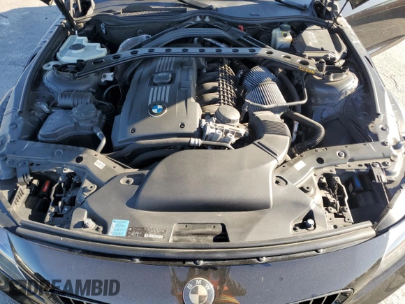 2011 BMW Z4 sDrive35is with VIN WBALM1C58BE393909, listed as a Copart auction lot 89218305 with 112,502 mi miles and Salvage title. Bid and sale history available at DreamBid. Image 13.