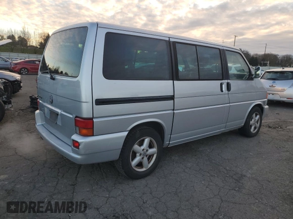 2003 Volkswagen EuroVan MV с VIN WV2MB47053H002505, выставлен на аукционе Copart как лот 83840884 с пробегом 250 786 миль миль и Чистый • Clean title. История ставок и продаж доступна на DreamBid. Изображение 3.