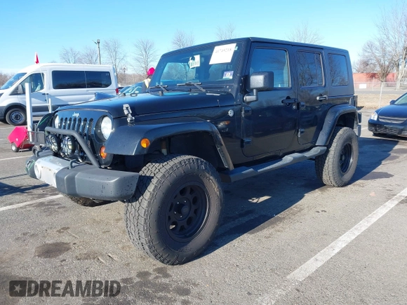 2010 Jeep Wrangler Unlimited Sahara with VIN 1J4HA5H16AL215659, listed as a IAAI auction lot 41749218 with 55,544 mi miles. Bid and sale history available at carsss.com. Image 2.