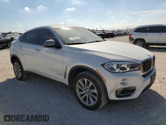 2018 BMW X6 sDrive35i with VIN 5UXKU0C5XJ0G69741, listed as a Copart auction lot 77366934 with 66,287 mi miles and Salvage Title. Bid and sale history available at carsss.com. Image 4.