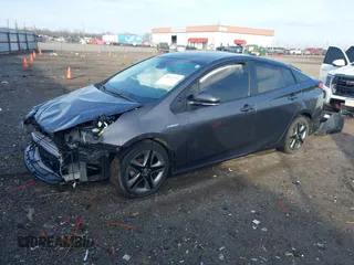 2021 Toyota Prius L Eco with VIN JTDKAMFU1M3149965, listed as a IAAI auction lot 38641916 with 69,942 mi miles. Bid and sale history available at carsss.com. Image 2.