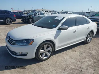 2015 Volkswagen Passat 1.8T Limited Edition with VIN 1VWAT7A34FC085880, listed as a IAAI auction lot 42007677 with 184,722 mi miles. Bid and sale history available at carsss.com. Image 2.