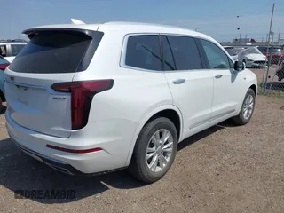 2023 Cadillac XT6 FWD Luxury z VIN 1GYKPAR4XPZ182533, wystawiony jako IAAI lot #42078937 z przebiegiem 31 248 mil mil oraz . Historia ofert i sprzedaży dostępna na DreamBid. Obrazek 4.