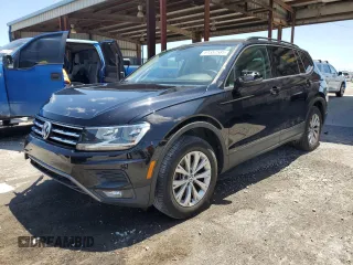 2018 Volkswagen Tiguan S with VIN 3VV1B7AX2JM027347, listed as a Copart auction lot 61557585 with 103,213 mi miles and Salvage title. Bid and sale history available at DreamBid. Image 1.