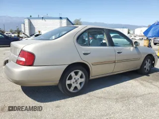2000 Nissan Altima XE z VIN 1N4DL01D5YC243801, wystawiony jako Copart lot #52642985 z przebiegiem 237 665 mil mil oraz Szkoda całkowita • Salvage title. Historia ofert i sprzedaży dostępna na DreamBid. Obrazek 3.