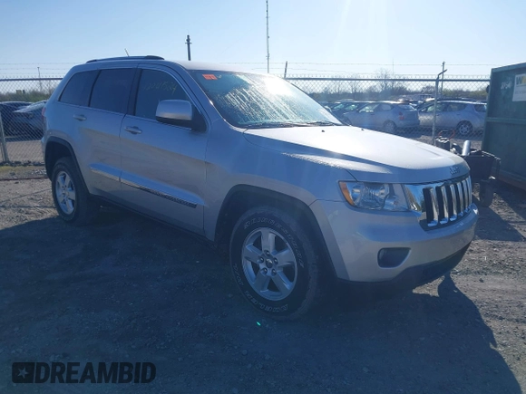 2013 Jeep Grand Cherokee Laredo with VIN 1C4RJFAG3DC586667, listed as a IAAI auction lot 42041524 with 100,635 mi miles. Bid and sale history available at carsss.com. Image 1.