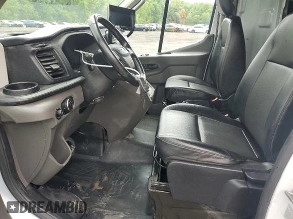 2020 Ford Transit Cargo with VIN 1FTBW3U88LKB34059, listed as a Copart auction lot 57055695 with 77,813 mi miles and Clean title. Bid and sale history available at DreamBid. Image 7.