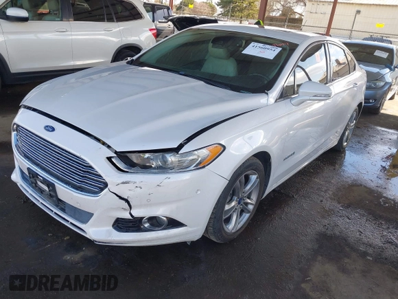 2016 Ford Fusion Titanium Hybrid with VIN 3FA6P0RU1GR191813, listed as a IAAI auction lot 41560954 with 86,922 mi miles. Bid and sale history available at carsss.com. Image 2.