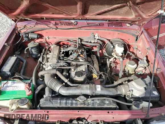 1992 Toyota Pickup DLX z VIN JT4RN93P1N5052818, wystawiony jako Copart lot #77344244 z przebiegiem 484 357 mil mil oraz Szkoda całkowita • Salvage title. Historia ofert i sprzedaży dostępna na DreamBid. Obrazek 11.