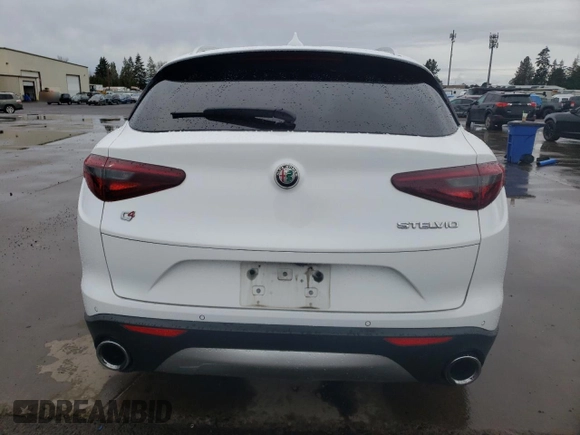 2018 Alfa Romeo Stelvio z VIN ZASFAKAN9J7B88322, wystawiony jako Copart lot #48808605 z przebiegiem 87 096 mil mil oraz Szkody całkowita. Historia ofert i sprzedaży dostępna na DreamBid. Obrazek 6.
