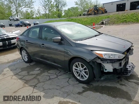 2018 Ford Focus SE z VIN 1FADP3F24JL204488, wystawiony jako Copart lot #54733625 z przebiegiem Nie podano mil oraz Szkoda całkowita • Salvage title. Historia ofert i sprzedaży dostępna na DreamBid. Obrazek 13.