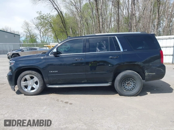 2015 Chevrolet Tahoe LTZ with VIN 1GNSKCKC8FR514671, listed as a IAAI auction lot 42157084 with 182,665 mi miles and . Bid and sale history available at DreamBid. Image 14.